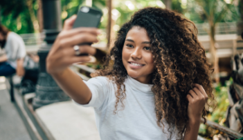 Young woman taking selfie outdoors